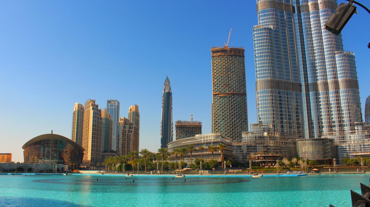 high rise buildings near body of water during daytime